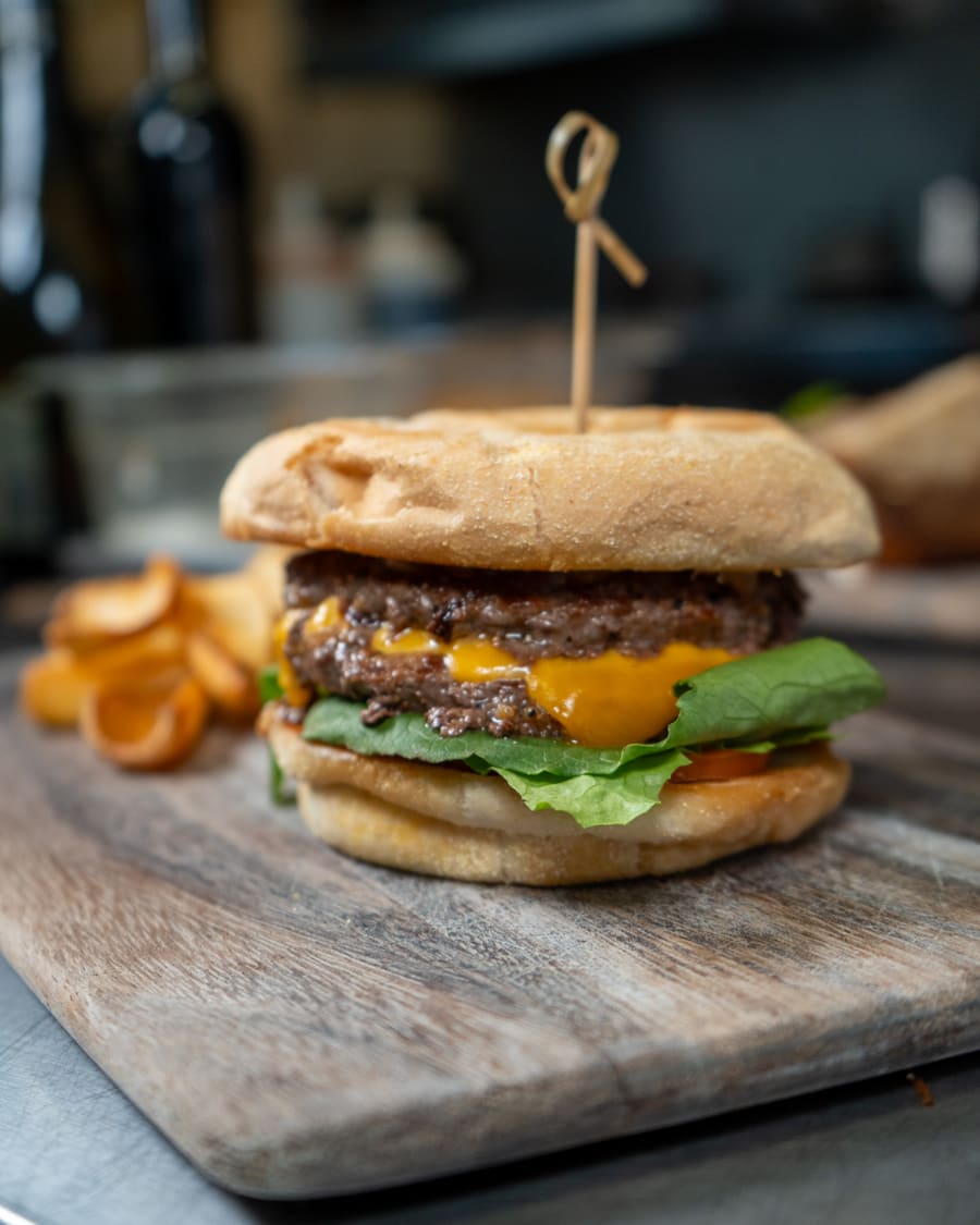 Burger served on a wooden board
