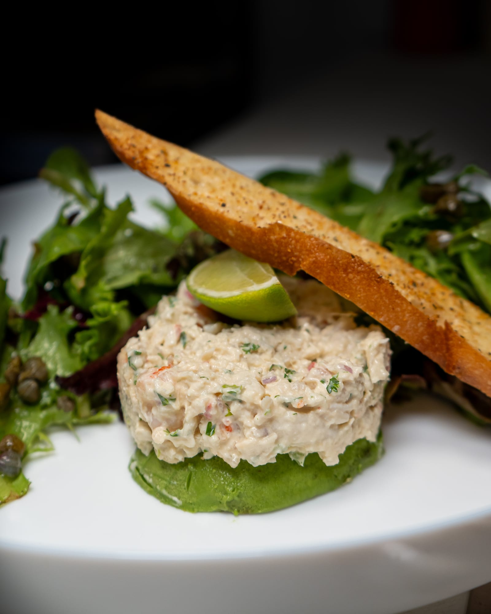 Crab salad starter with crostini and greens at La Cocina at The Cellar Upstairs